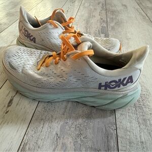 Woman’s 7.5 Hoka still a lot of life left in them. White mint and orange.